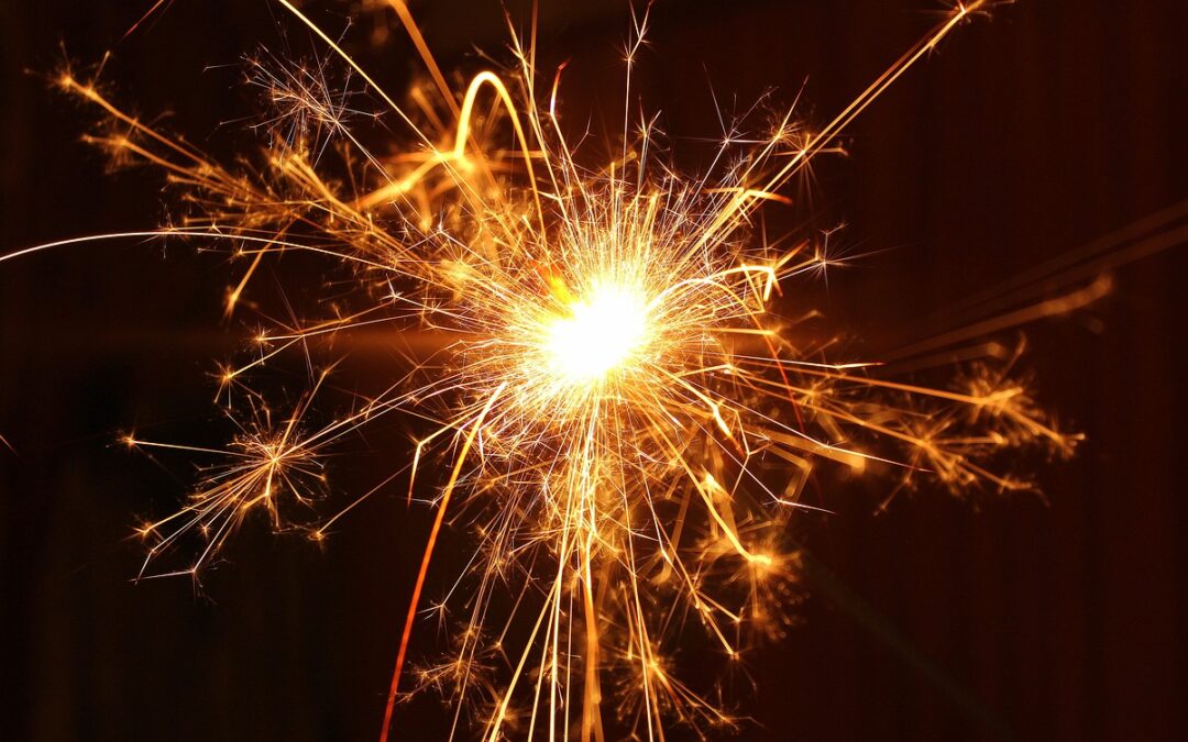 Image of a sparkler in front of a black background